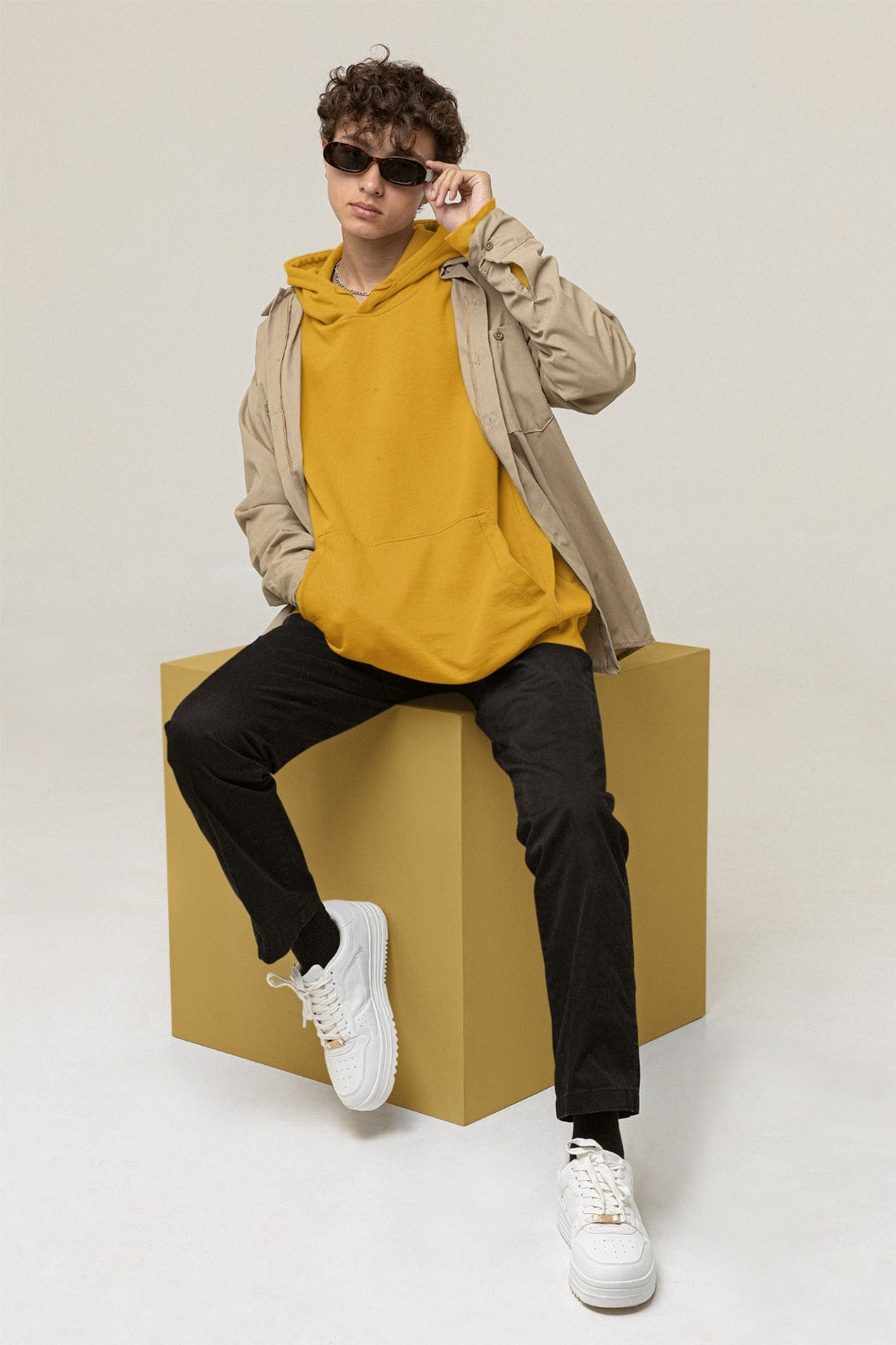 A mustard color hoodie crafted with the finest materials for ultimate comfort and style.
