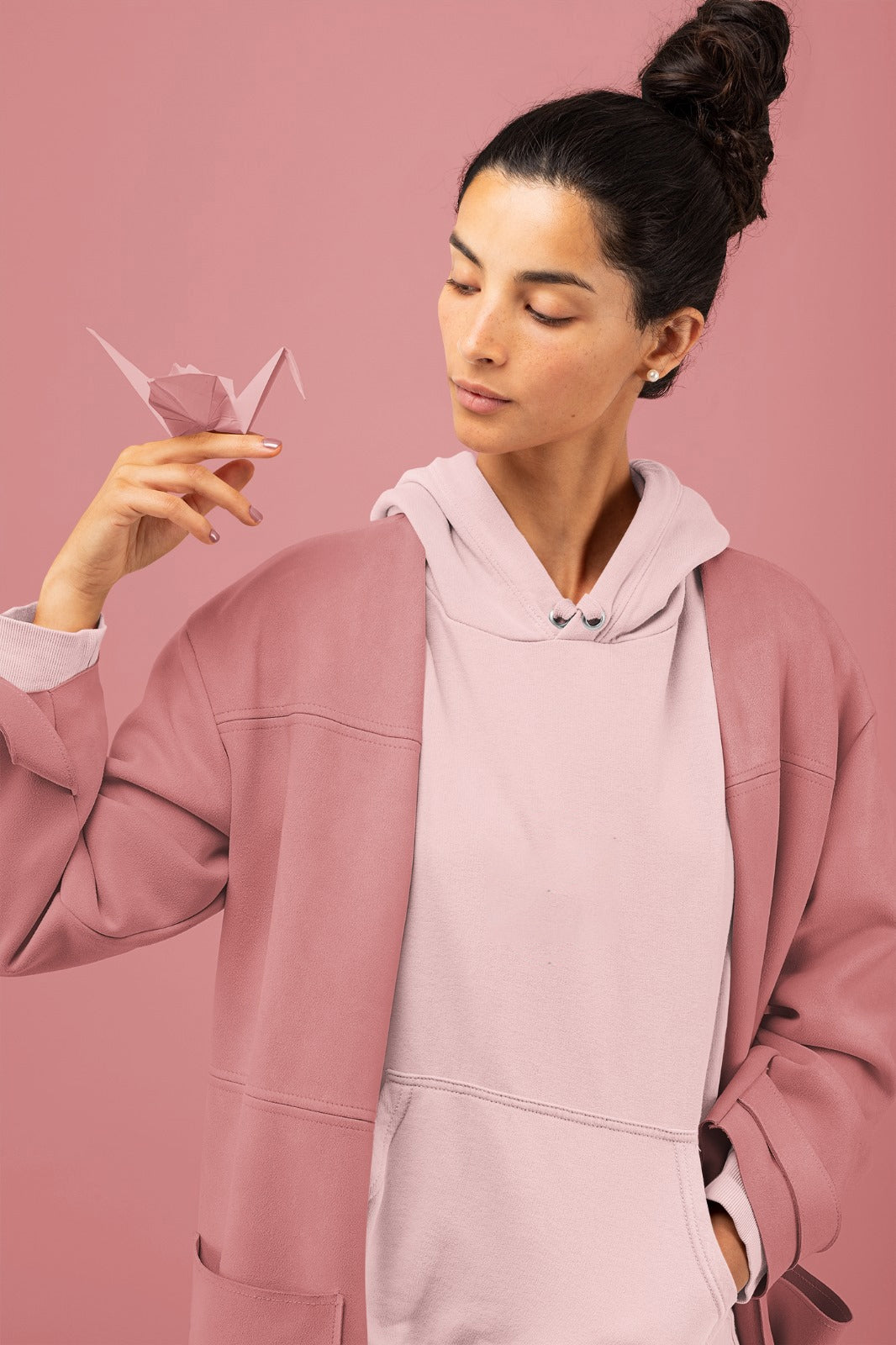 A light pink mid-weight hoodie perfect for daily wear, tailored for women.