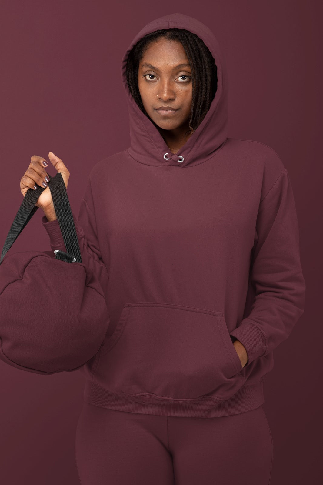 A maroon mid-weight hoodie perfect for daily wear, tailored for women.