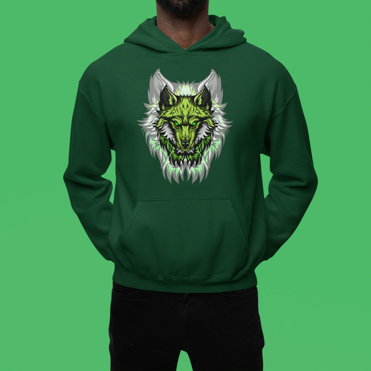A men wearing a forest green hoodie with captivating scene of a wolf howling amidst swirling flames, evoking a sense of primal energy.