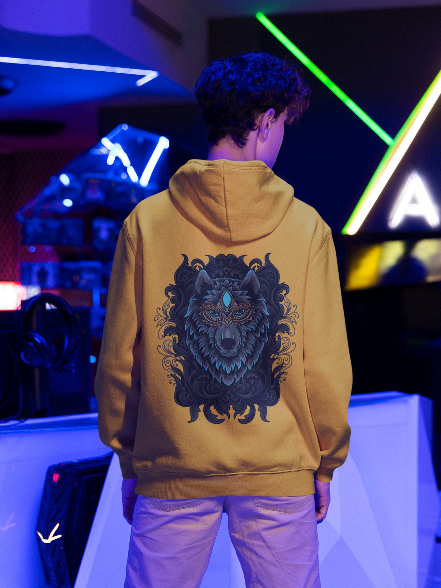 A men wearing a mustard color fashionable hoodie showcasing the elegance and might of Wepwawet, the ancient Egyptian god.