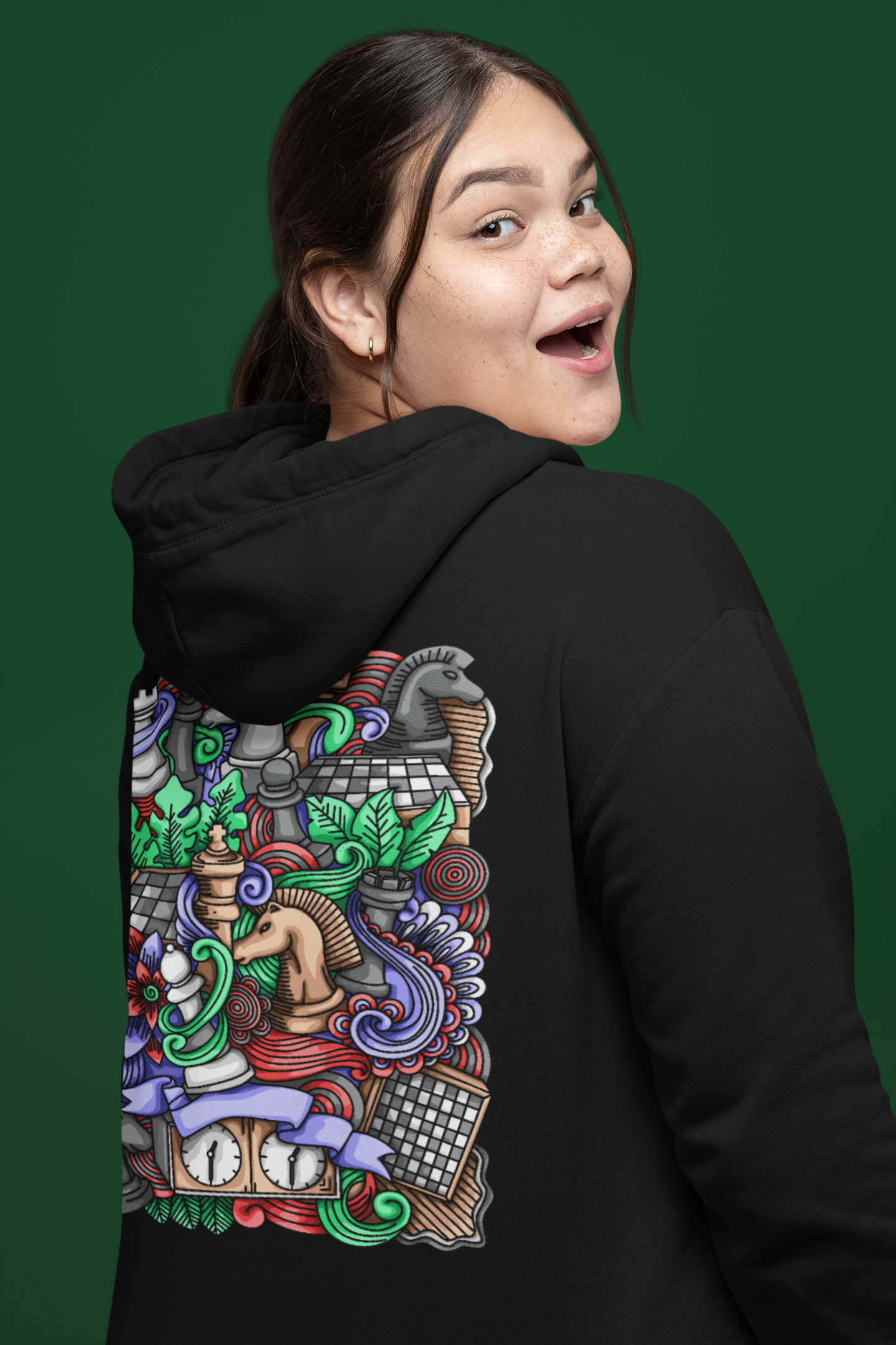 Excited girl wearing cool black hoodie with huge chess print.