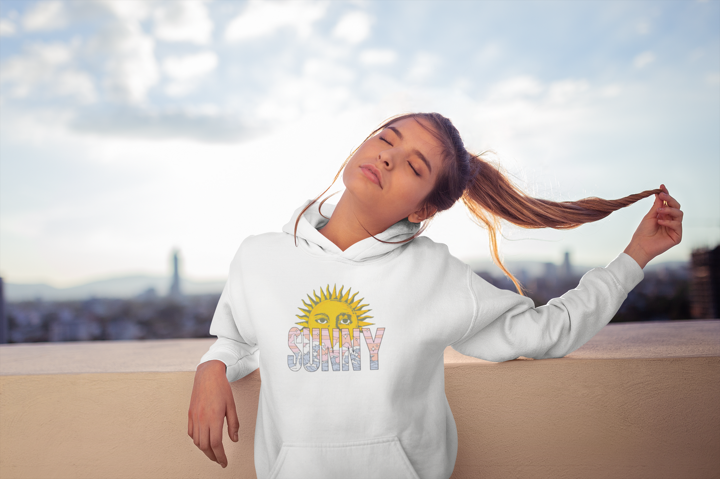 Cute girl is relaxing in morning wearing a white sunny day graphic hoodie