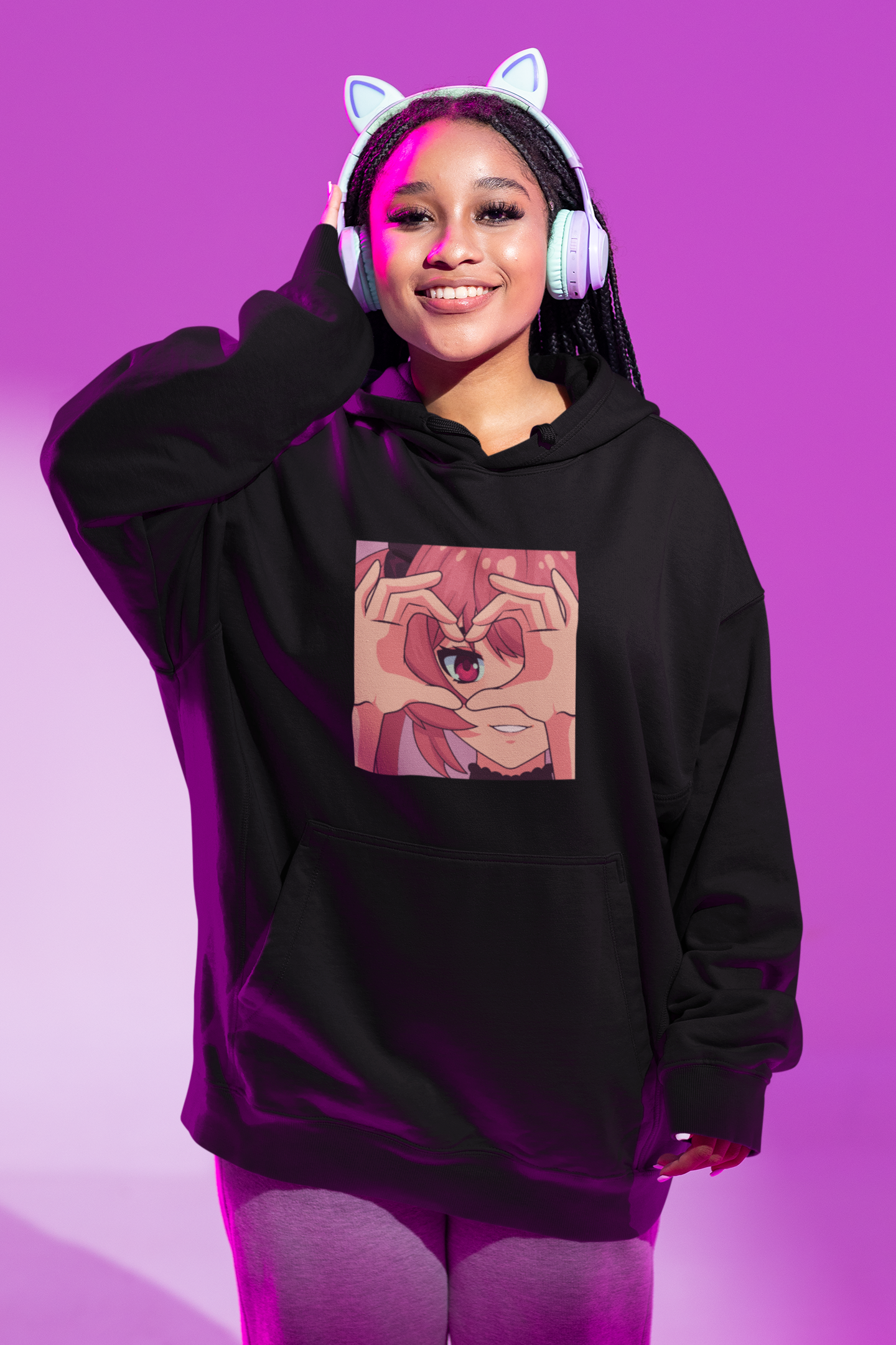 Girl with kitty headphones wearing oversized anime character printed hoodie