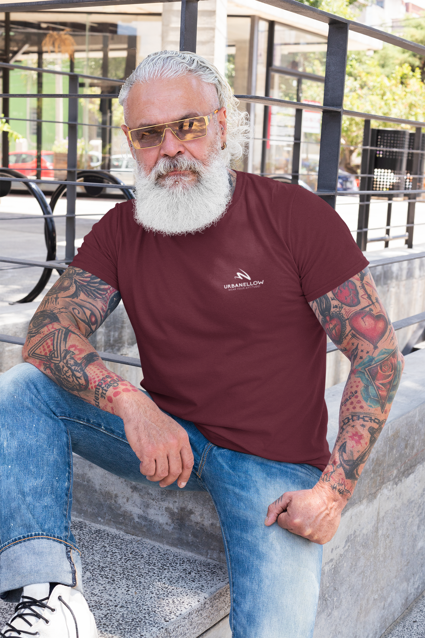 A men wearing a maroon color signature piece from the Urbanellow brand, known for its style and quality.