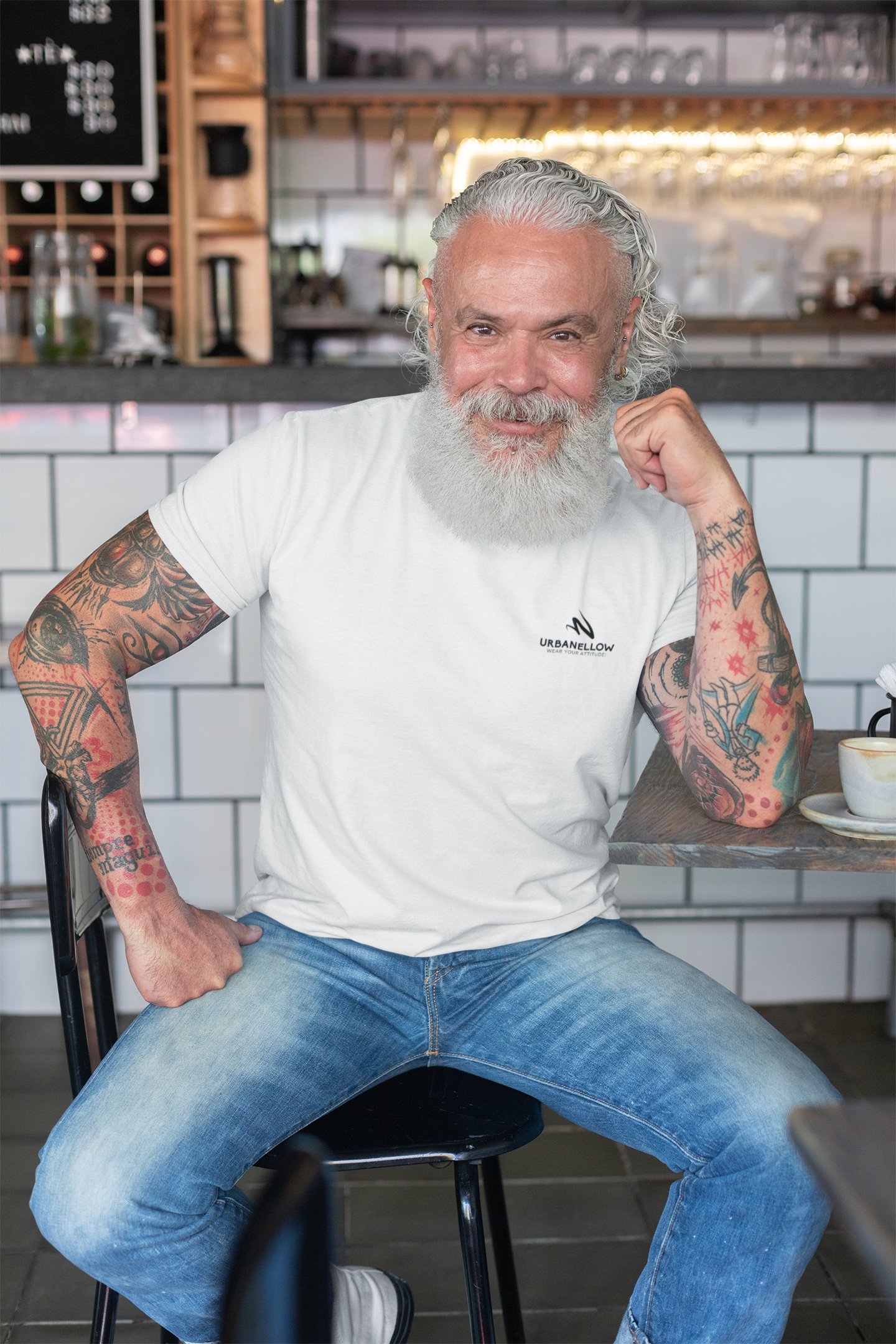 A men wearing a white color signature piece from the Urbanellow brand, known for its style and quality.