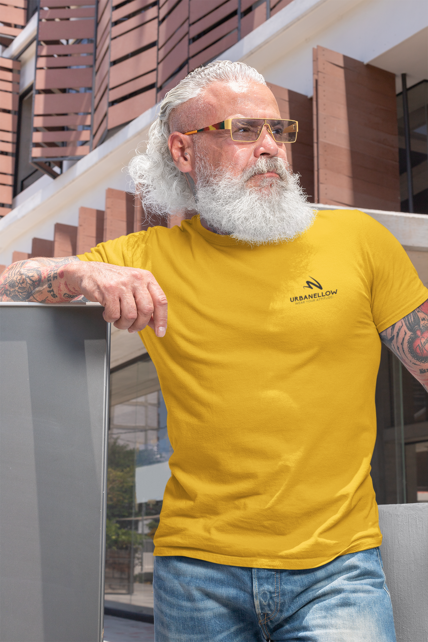 A men wearing a mustard color signature piece from the Urbanellow brand, known for its style and quality.