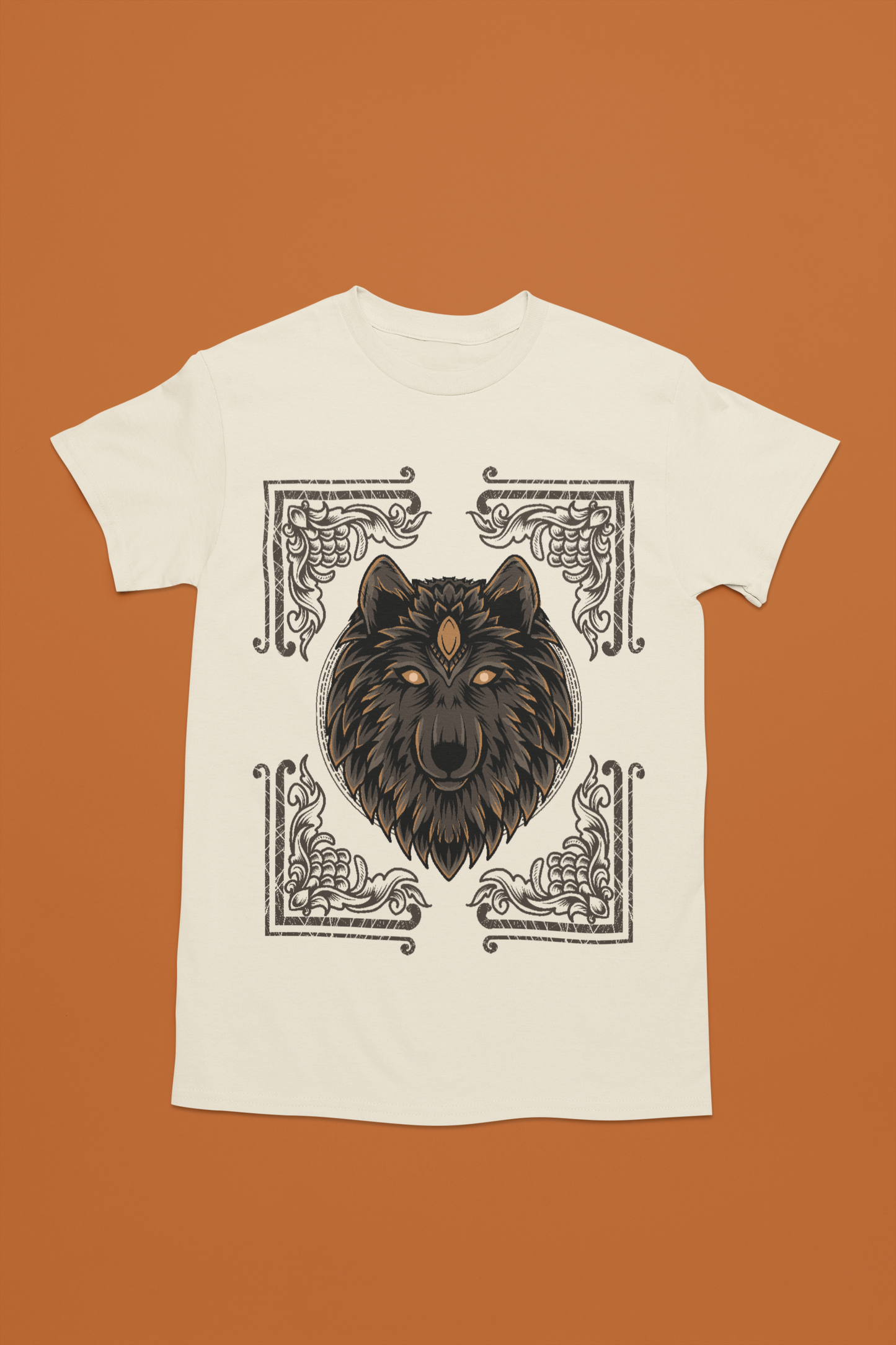A sand color tee that blends Egyptian mythology and nature, with a wolf encased in a decorative card.