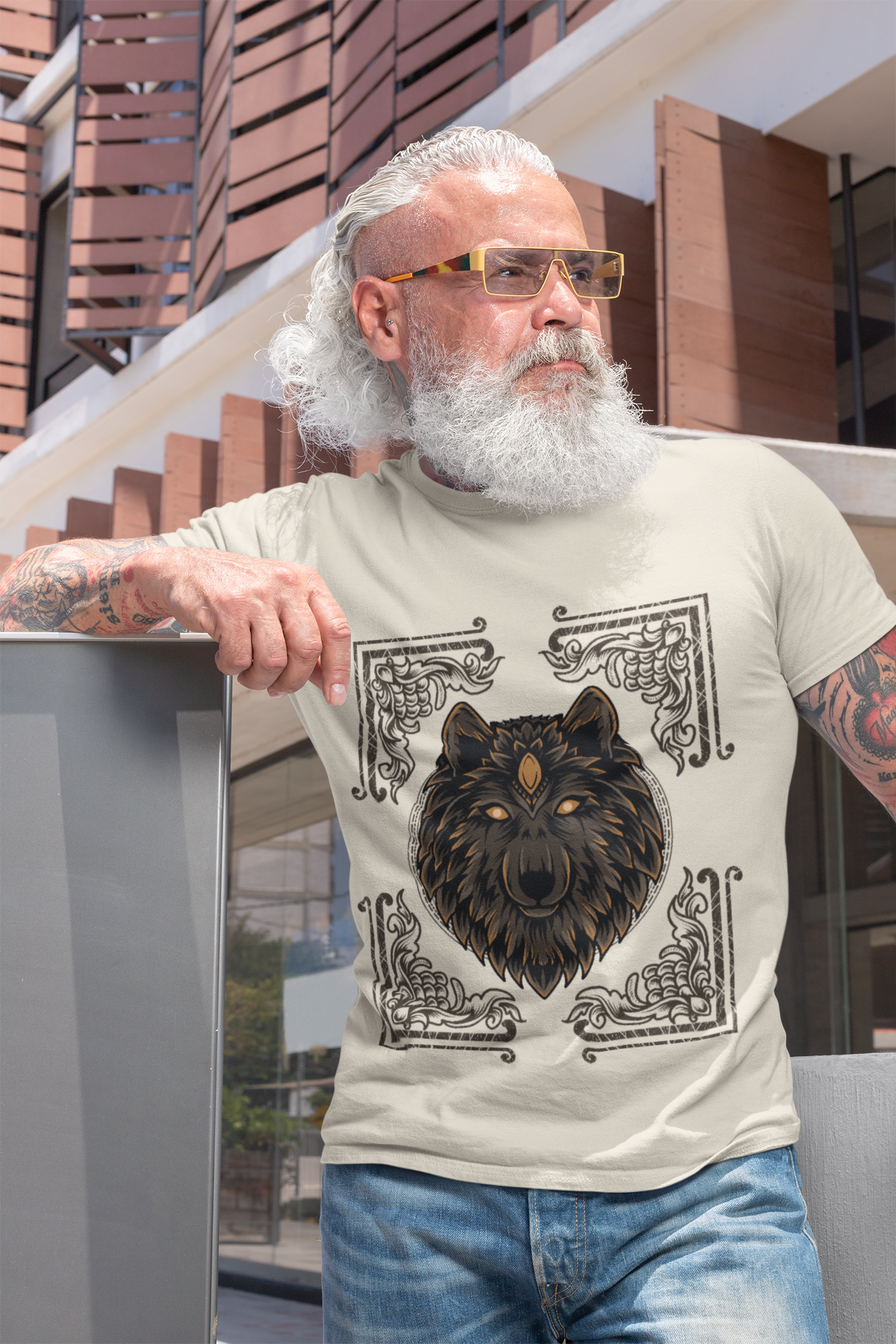A men wearing a tee that blends Egyptian mythology and nature, with a wolf encased in a decorative card.