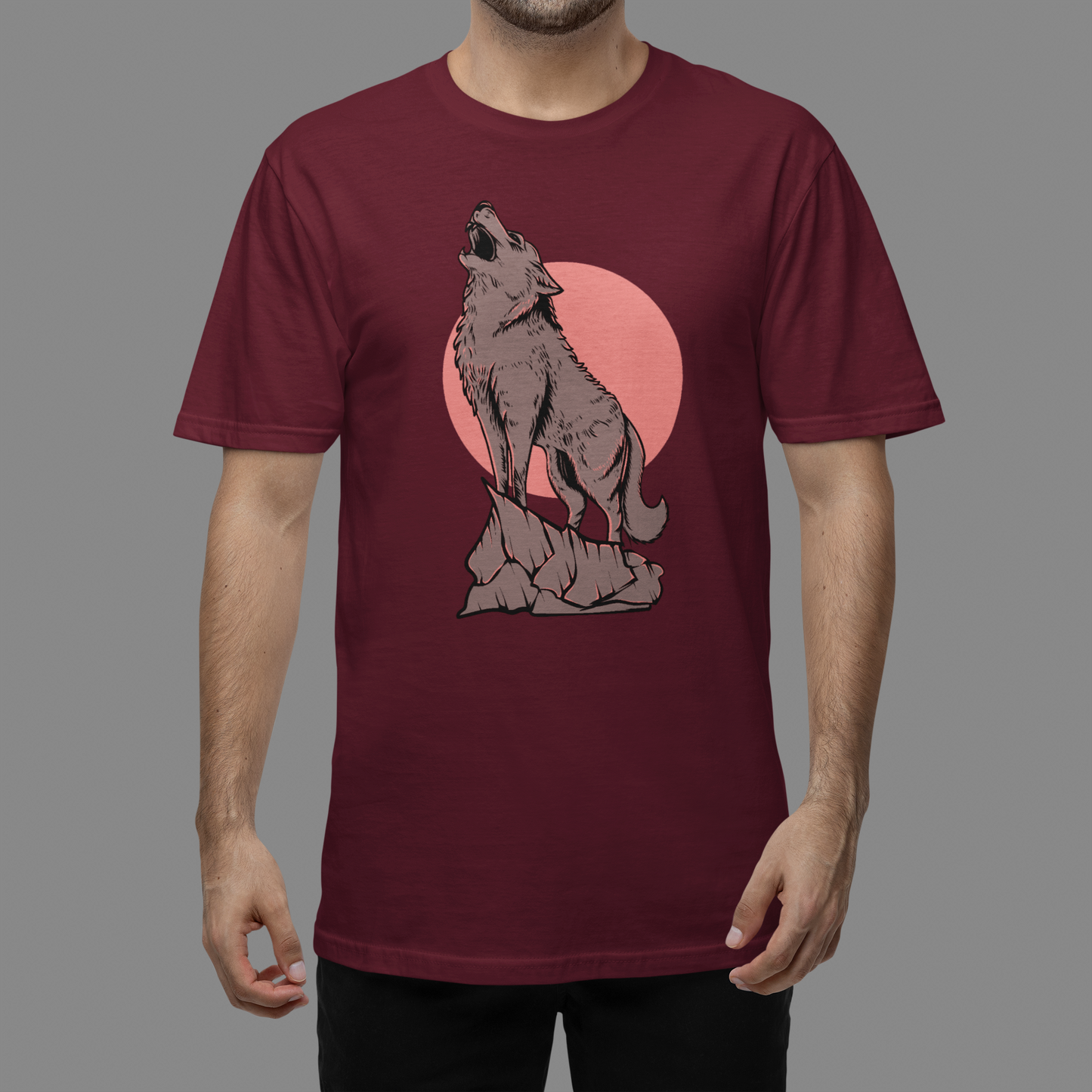 A maroon t-shirt with serene and enchanting scene of a wolf in the moonlight, with the full moon illuminating the wilderness.